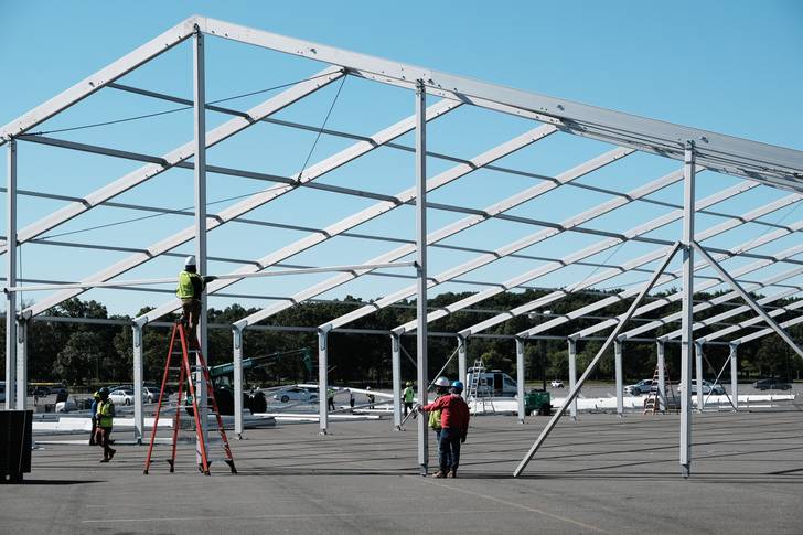 Large tents are constructed in a parking lot at Orchard Beach in the Bronx on September 27th, 2022.
